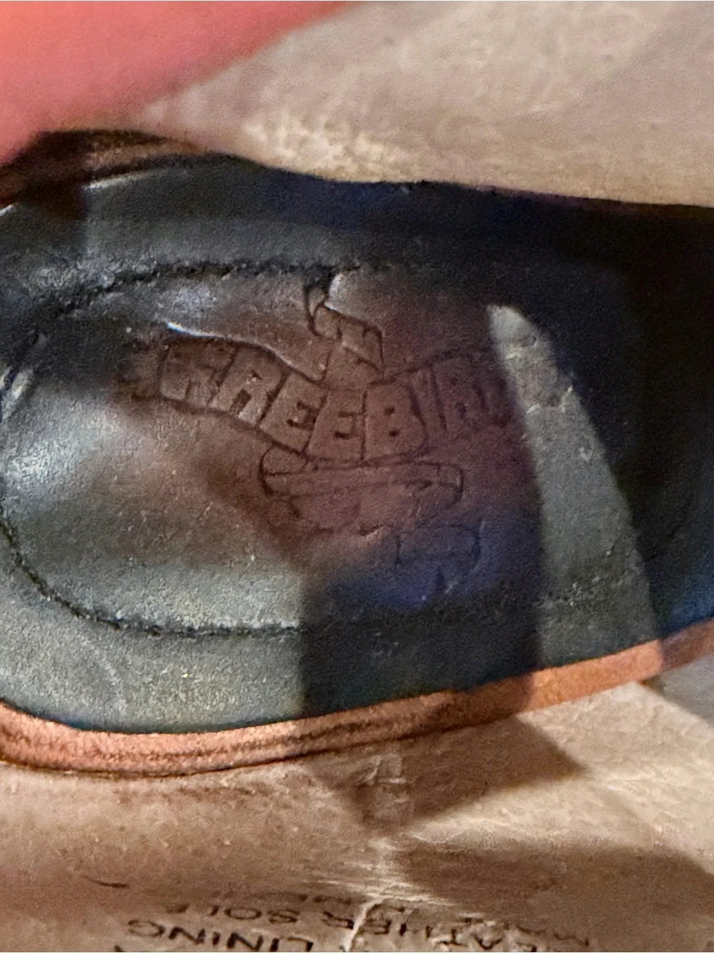 freebird Black and Brown Leather Slip-On Shoe with Embossed Logo